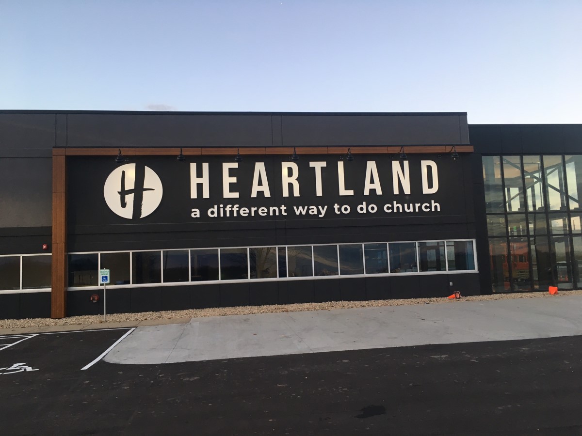 Outdoor signage on exterior of building for church